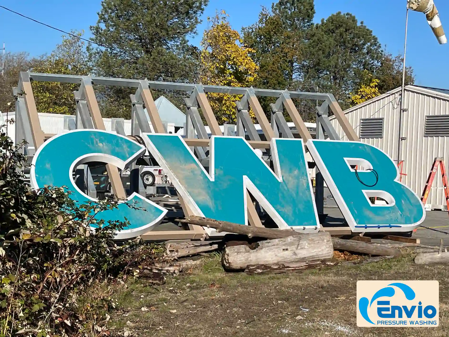 Esso sign cleaning before